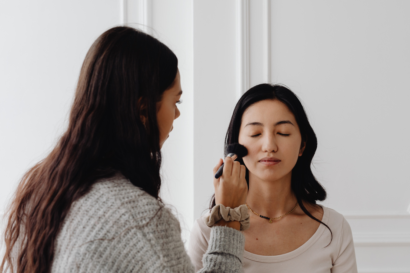 A Make-up Artist Applying Make-up to the Client